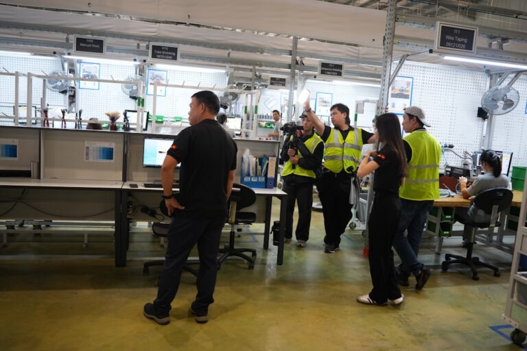 People in a modern office or factory setting